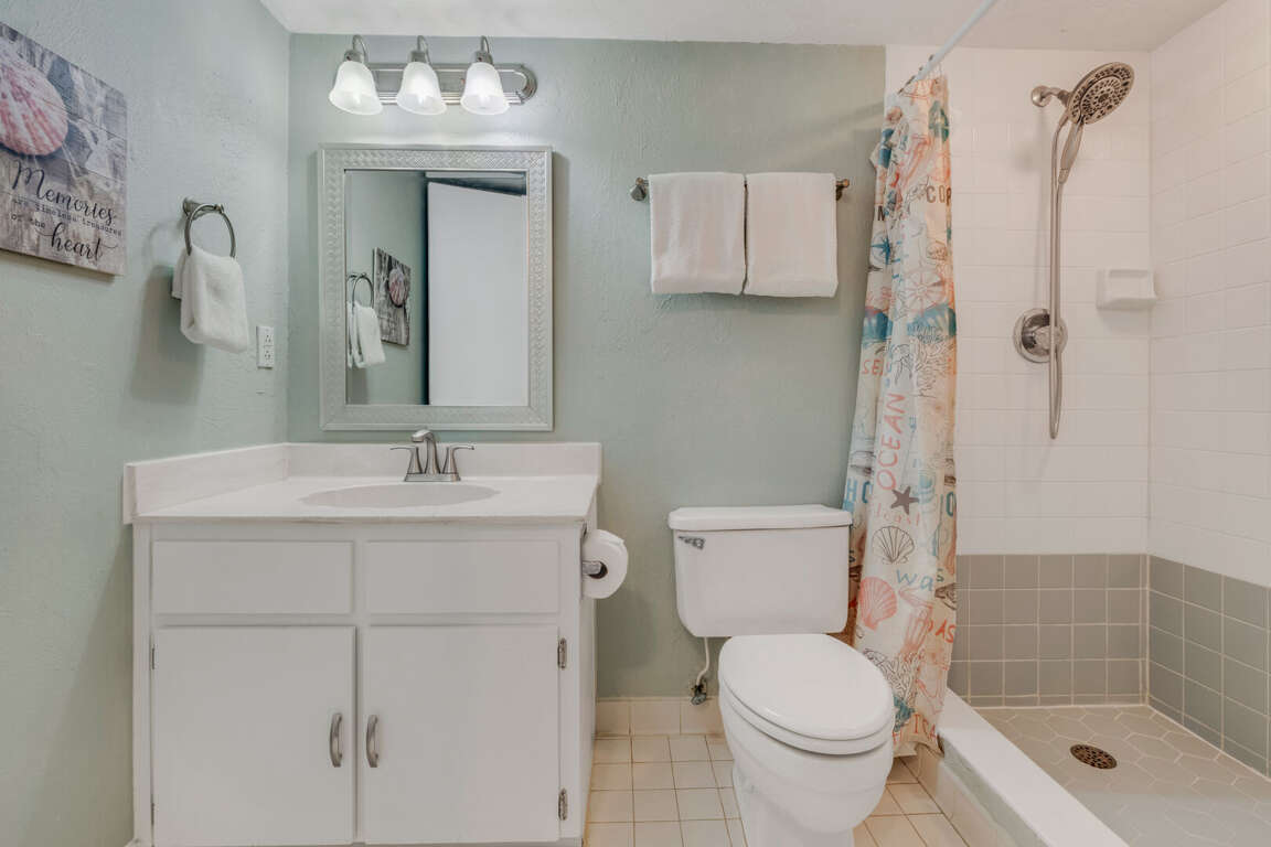 Guest bathroom featuring a stylish tile shower for a modern, refreshing experience Guest bathroom featuring a stylish tile shower for a modern, refreshing experience