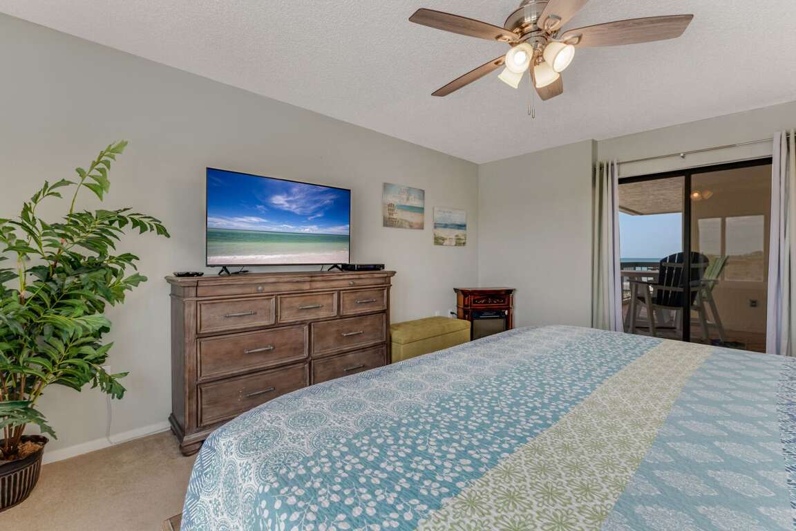 The master bedroom offers a king bed, large TV, private balcony access, and a convenient ensuite bathroom The master bedroom offers a king bed, large TV, private balcony access, and a convenient ensuite bathroom