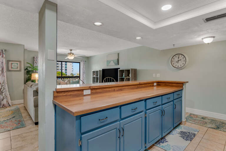 Prepare meals at the kitchen counter with an open layout overlooking the spacious living room—perfect for staying connected while cooking Prepare meals at the kitchen counter with an open layout overlooking the spacious living room—perfect for staying connected while cooking