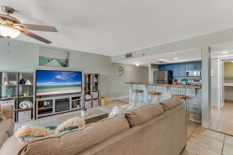 Relax in the comfortable living room, beautifully decorated with beachy coastal accents for a cozy, seaside vibe Relax in the comfortable living room, beautifully decorated with beachy coastal accents for a cozy, seaside vibe