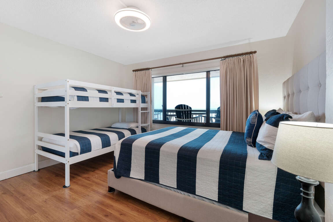 Queen bed and twin bunk bed in the Guest Bedroom Queen bed and twin bunk bed in the Guest Bedroom