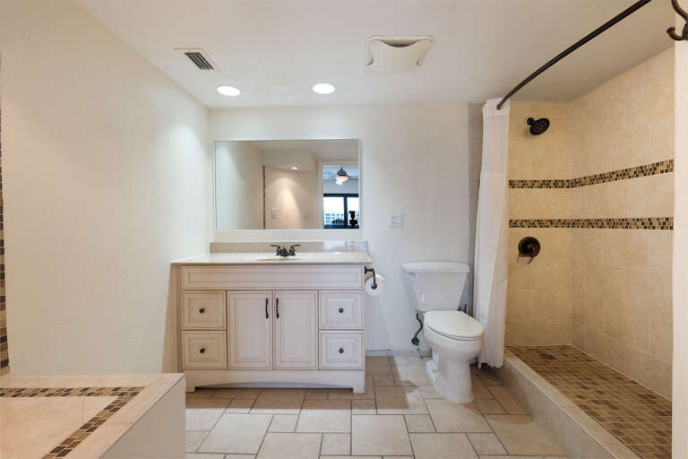 Updated tile shower in the Master Bathroom Updated tile shower in the Master Bathroom