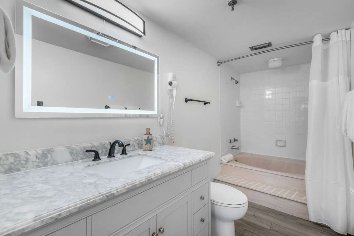 The ensuite master bathroom offers a tub/shower combo and an anti-fog mirror The ensuite master bathroom offers a tub/shower combo and an anti-fog mirror