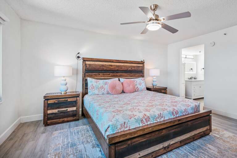 The master bedroom features a comfortable king bed, large TV, and ensuite bathroom The master bedroom features a comfortable king bed, large TV, and ensuite bathroom