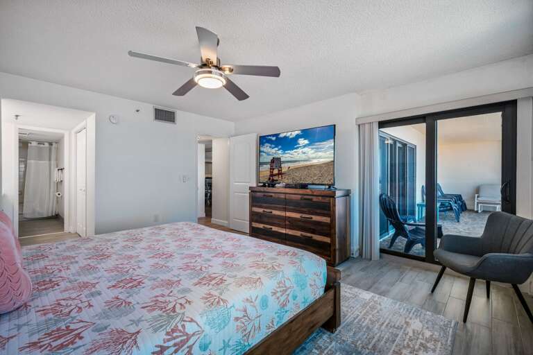 The master bedroom features a private ensuite bathroom, large TV, and direct access to the oceanfront balcony The master bedroom features a private ensuite bathroom, large TV, and direct access to the oceanfront balcony