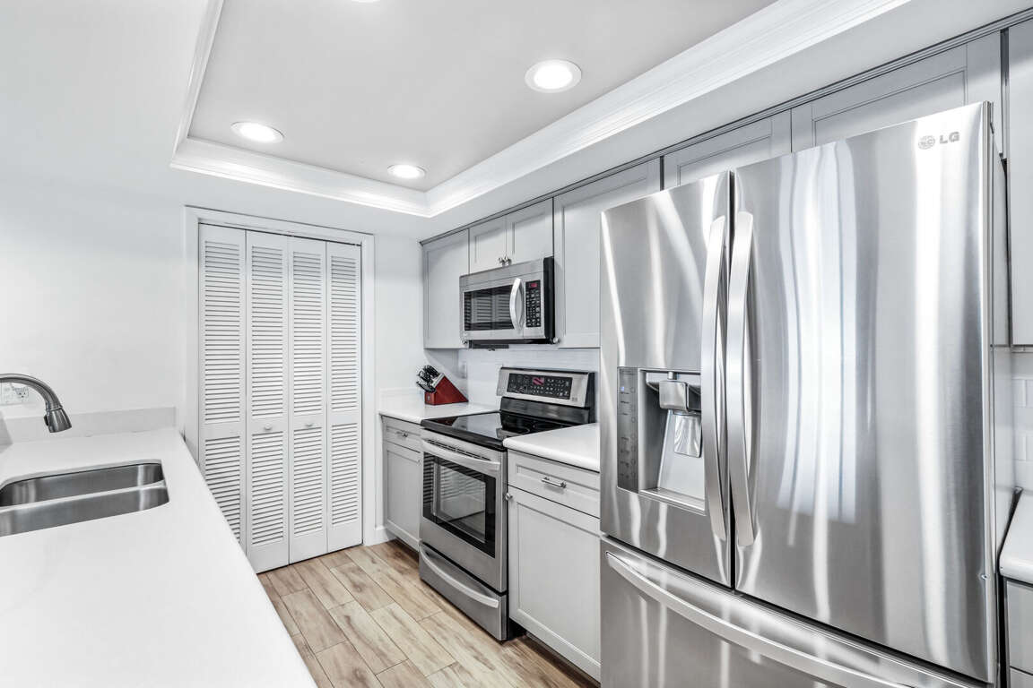The updated kitchen features sleek stainless steel appliances and modern finishes The updated kitchen features sleek stainless steel appliances and modern finishes