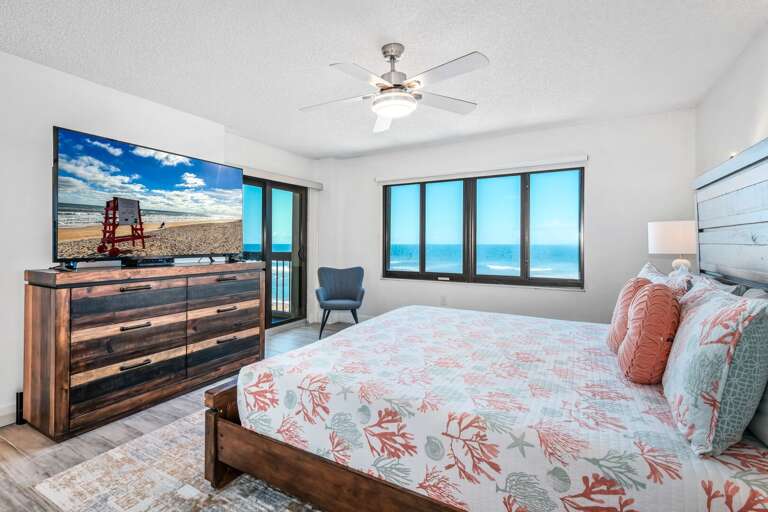 Wake up to breathtaking ocean views in the spacious master suite, featuring a king bed and a large TV Wake up to breathtaking ocean views in the spacious master suite, featuring a king bed and a large TV