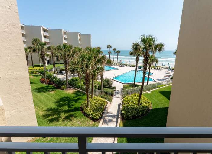 Enjoy breathtaking views from this 3rd-floor balcony, overlooking the Pelican's sparkling pools, New Smyrna Beach, and the Atlantic Ocean Enjoy breathtaking views from this 3rd-floor balcony, overlooking the Pelican's sparkling pools, New Smyrna Beach, and the Atlantic Ocean