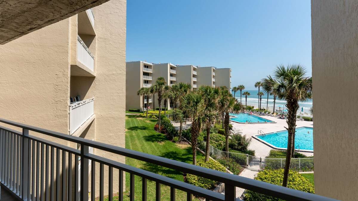 Enjoy a private 3rd-floor balcony with stunning views of The Pelican's pool deck and the beautiful New Smyrna Beach Enjoy a private 3rd-floor balcony with stunning views of The Pelican's pool deck and the beautiful New Smyrna Beach