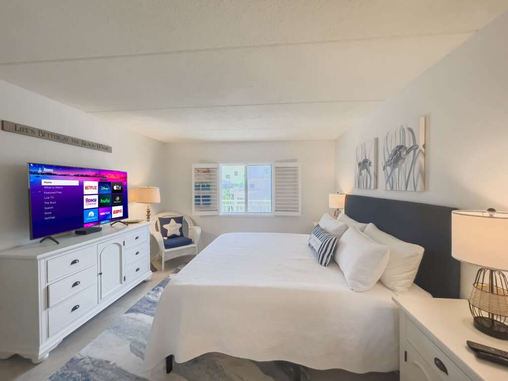 The master bedroom suite features a luxurious king bed, offering the perfect place to unwind and rest The master bedroom suite features a luxurious king bed, offering the perfect place to unwind and rest