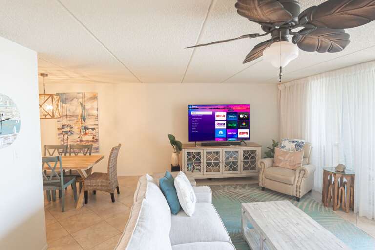 The oceanfront living room features a large smart TV The oceanfront living room features a large smart TV