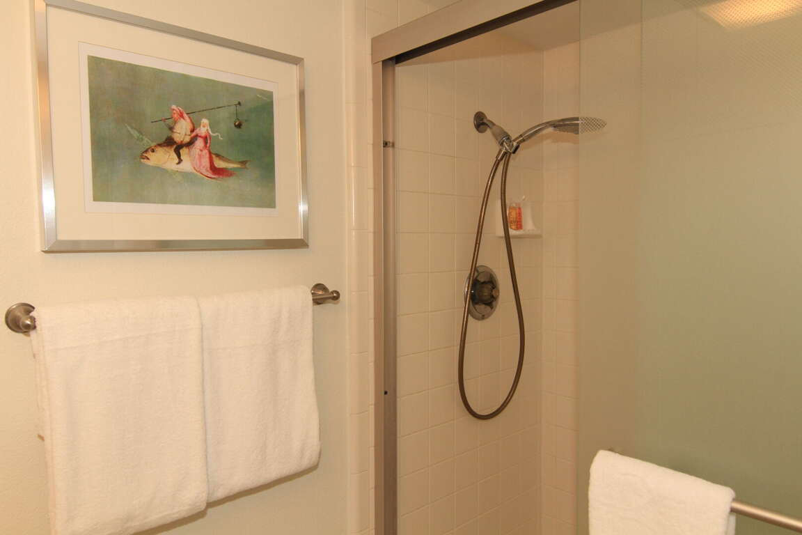 Refresh in the guest bathroom, featuring a tile and glass shower Refresh in the guest bathroom, featuring a tile and glass shower