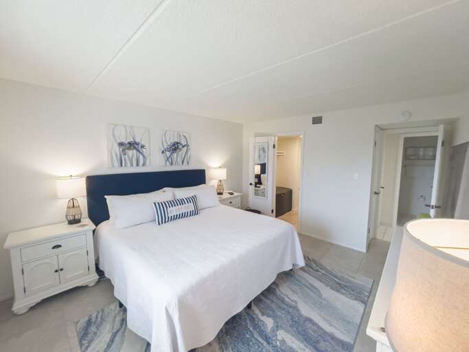 Sleep soundly in the master bedroom, featuring a comfortable king-sized bed for the ultimate rest and relaxation Sleep soundly in the master bedroom, featuring a comfortable king-sized bed for the ultimate rest and relaxation
