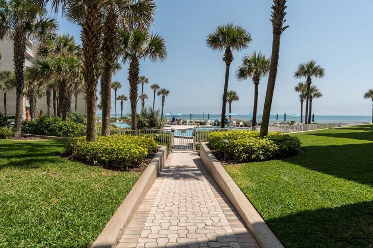 On your way to the beach, stroll through The Pelican's pool deck, featuring multiple pools and shuffleboard courts On your way to the beach, stroll through The Pelican's pool deck, featuring multiple pools and shuffleboard courts