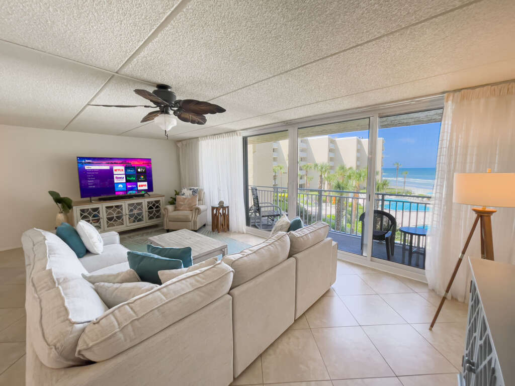 Take in stunning ocean views from the living room, where the beauty of the beach is just steps away Take in stunning ocean views from the living room, where the beauty of the beach is just steps away