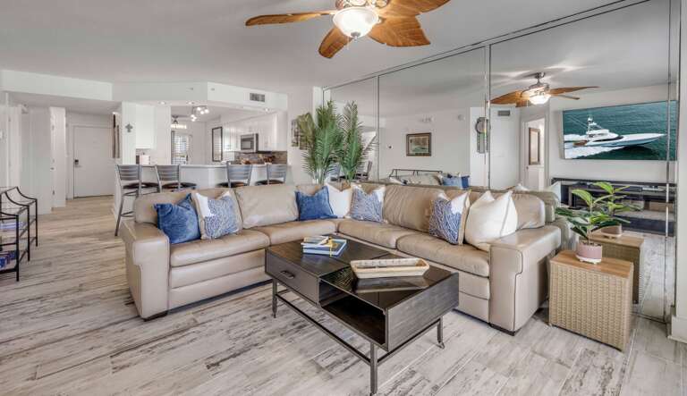 Updated interior with a coastal farmhouse vibe, featuring a large sectional in the living room