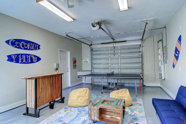 Garage Converted Into Living Space With Furniture And Decorations