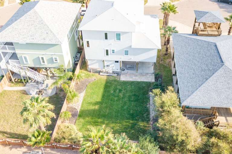 Aerial View Of Residential Buildings With Lawn And Palm Trees