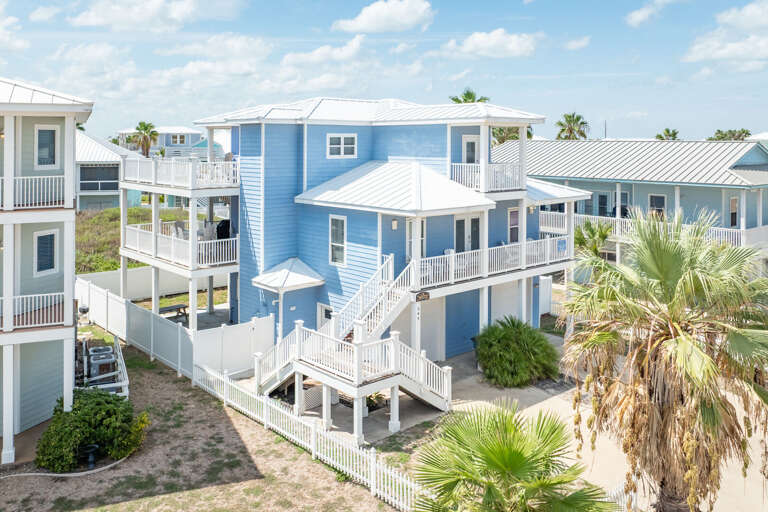 Blue Buildings By Beach, Balconies, Breezes, Bright Skies