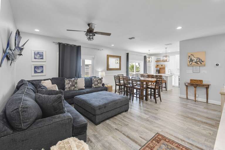 Spacious Living Room With Soft Sofa And Sleek Dining Space