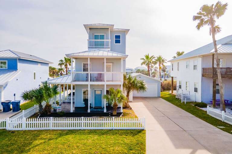 Three-story Residential Building With White Picket Fence