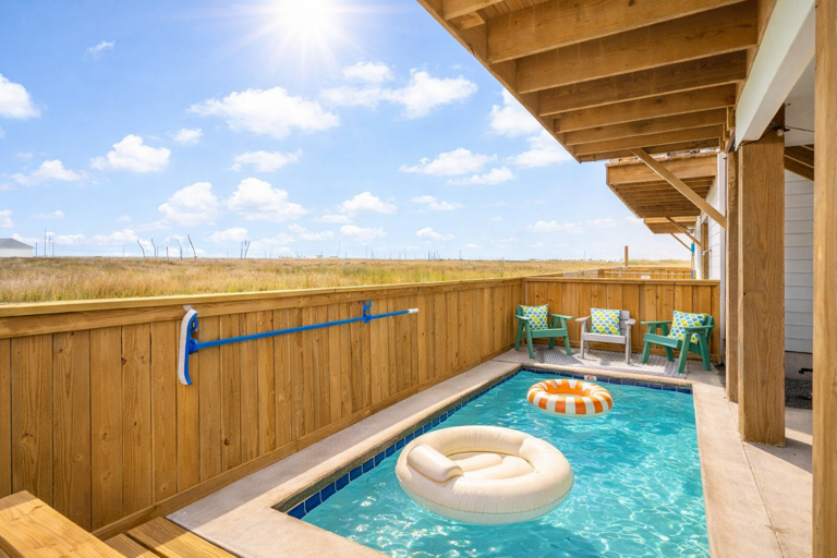 Sunny Poolside With Chairs, Cushions, And Floaties In A Vacation Rental