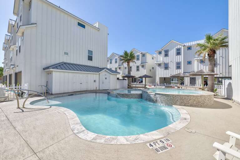 Poolside Paradise With Pristine Palm Trees And Pale Buildings