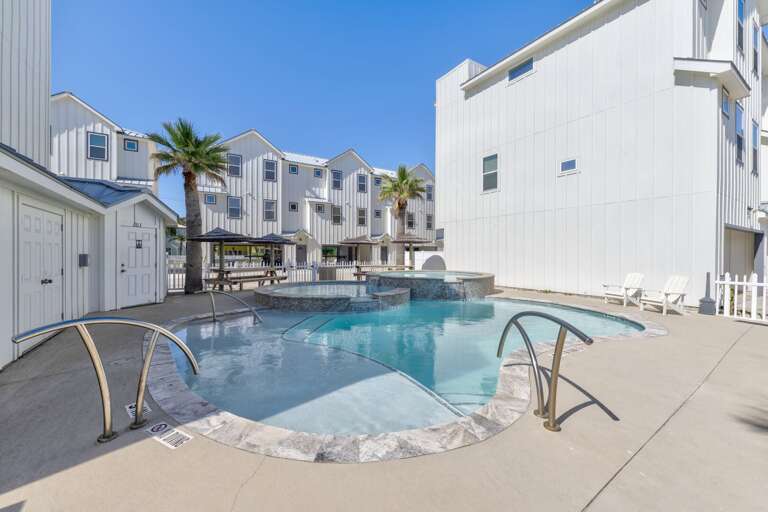 Poolside Paradise With Palm Trees And White Buildings