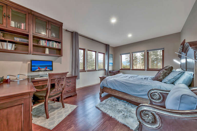 Mountain views, queen bed, desk area.