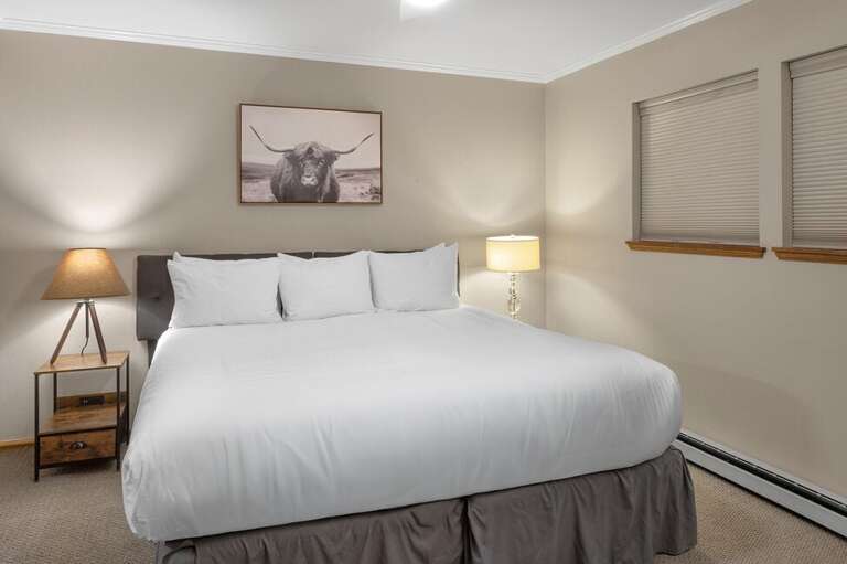 The second bedroom features two twin beds (convertible to a king upon request) and a private en suite bathroom.