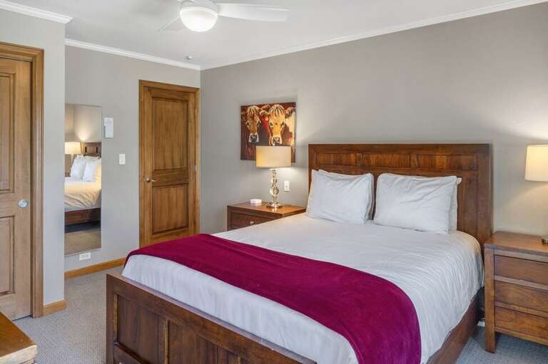 The primary suite features kind bed and ensuite bathroom with step in shower.