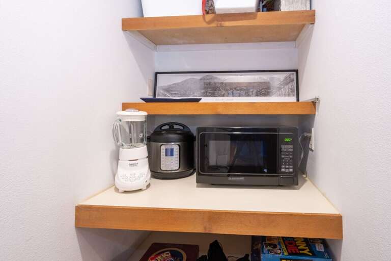 Pantry closet near kitchen is home to additional kitchen amenities.