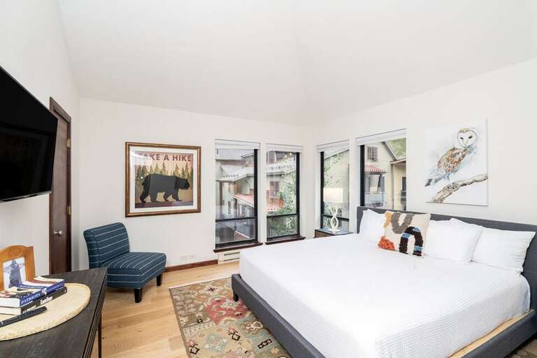 Primary suite features King bed, walk-in closet and ensuite bathroom, located on main level.