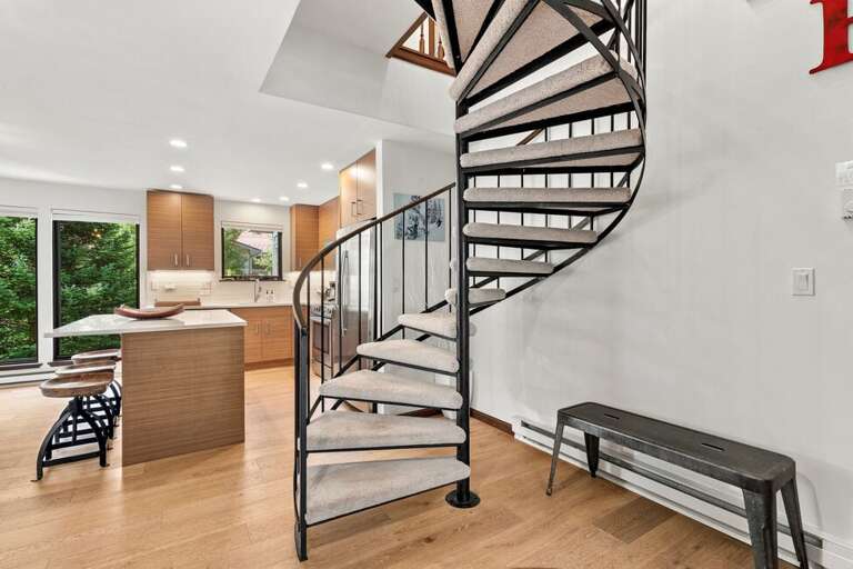 Spiral staircase to upstairs guest bedrooms.