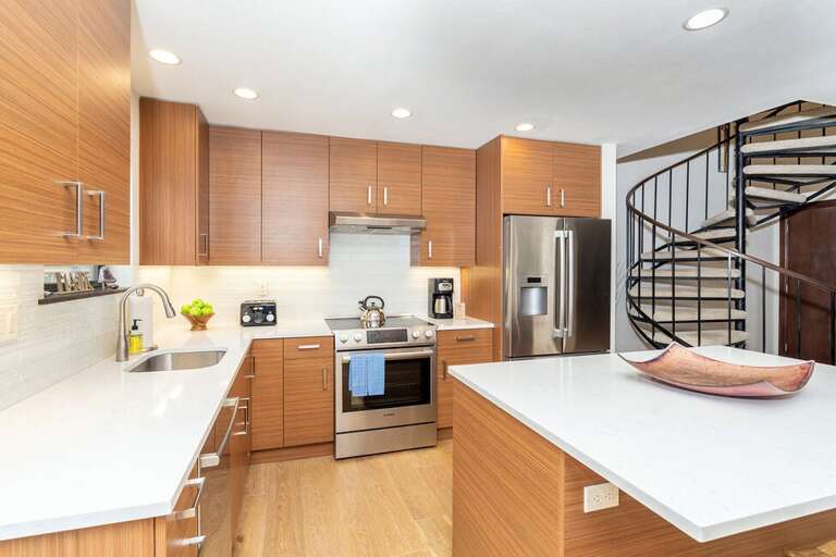 Stainless Steel appliances and updated flooring/cabinetry to top off this beautiful kitchen.