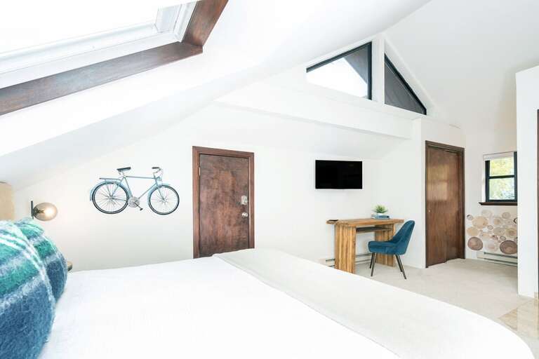 Look at the stars at night or the sun rising in the AM- the skylights bring in plenty of light to Guest room One.