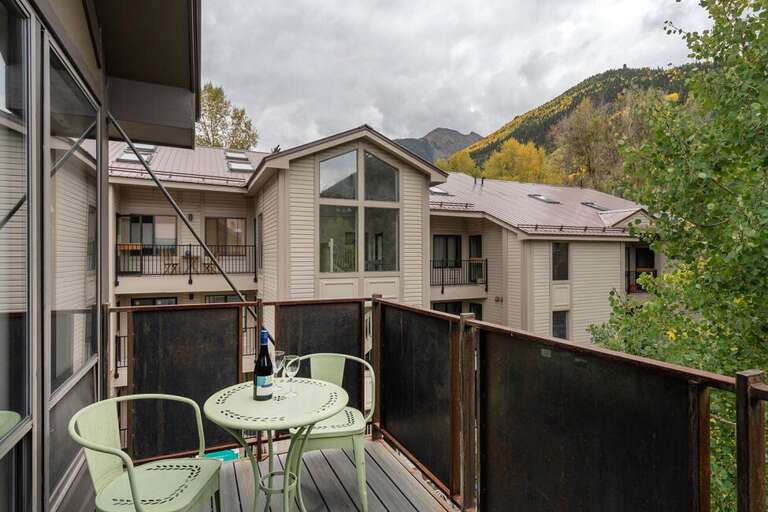 Sunny deck off of the living room- great views year round!