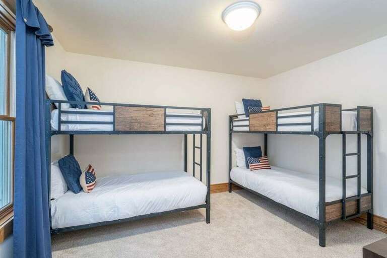 The bunk room features two stylish sets of twin bunk beds offering lots of space and a fun retreat for the kids! There is a full bathroom with tub just across the hall. The bunk room features two stylish sets of twin bunk beds offering lots of space and a fun retreat for the kids! There is a full bathroom with tub just across the hall.