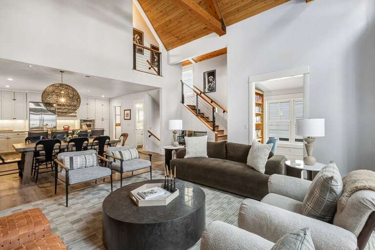 The great room provides high ceilings,  natural light a cozy gas fireplace as well as stunning views of the surrounding mountains.