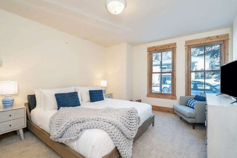 This king bedroom features an en-suite bathroom and flat screen TV. This king bedroom features an en-suite bathroom and flat screen TV.