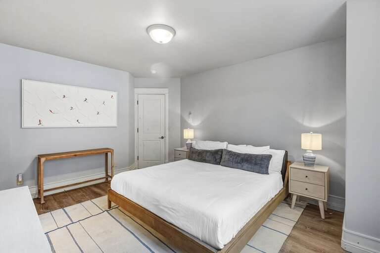 This king guest room, located on the entry level, features an en-suite bathroom and flat screen TV.