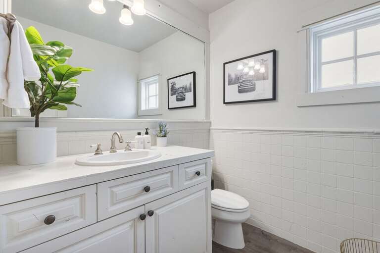 The Living/Kitchen level features a powder room with single vanity.