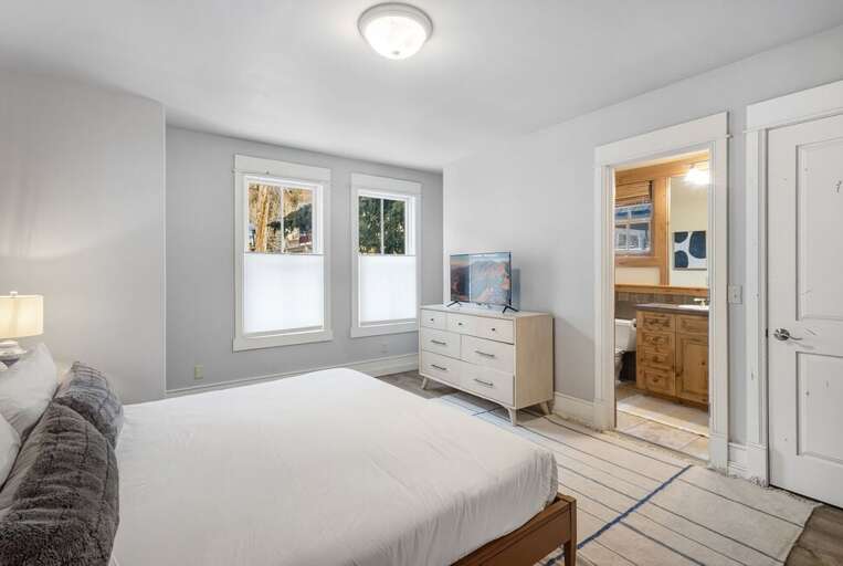 Natural light and spacious guest room with ensuite located on the entry level of the home.