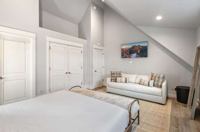 The primary suite features a King Bed and ensuite bathroom with high ceilings and a spa like ensuite bathroom.