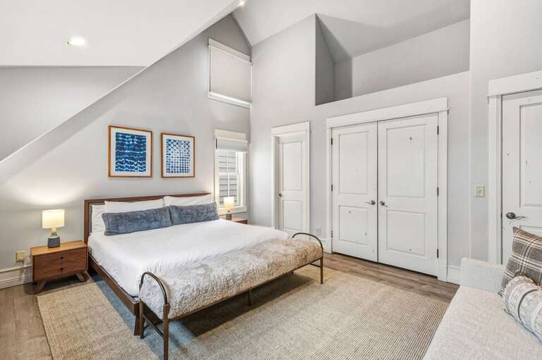 The Primary suite, located on the top level of this luxury home, features ensuite bathroom and King size bed.