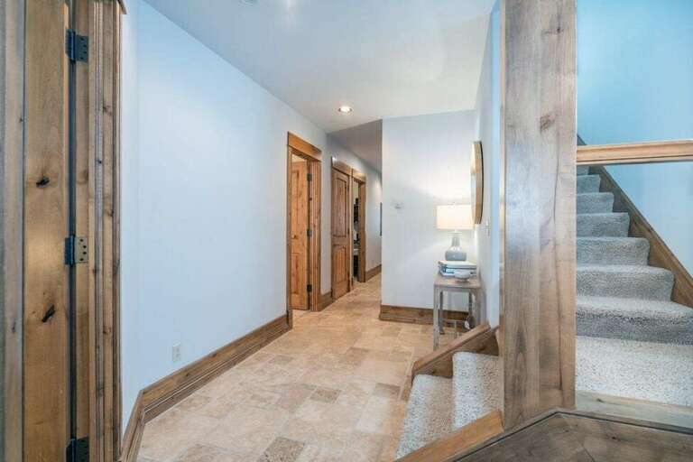 Utilize the keyless entry through the rear first floor door. The first floor features three bedrooms, one with an en suite bathroom, and an additional bathroom in the hallway. Utilize the keyless entry through the rear first floor door. The first floor features three bedrooms, one with an en suite bathroom, and an additional bathroom in the hallway.