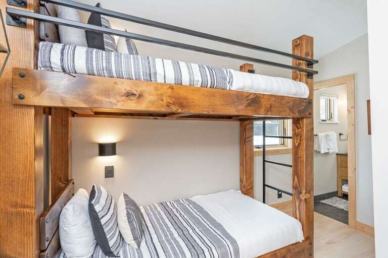 A third bedroom offers a twin bunk set-up and ensuite shower/bathroom. A third bedroom offers a twin bunk set-up and ensuite shower/bathroom.