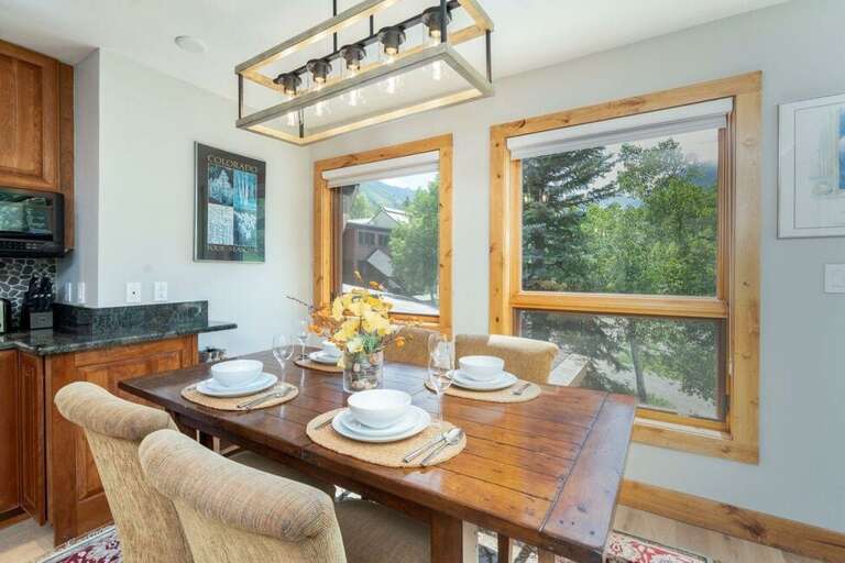 There is a dining table for 4 guests next to the kitchen, overlooking the base of Chair 7. There is a dining table for 4 guests next to the kitchen, overlooking the base of Chair 7.