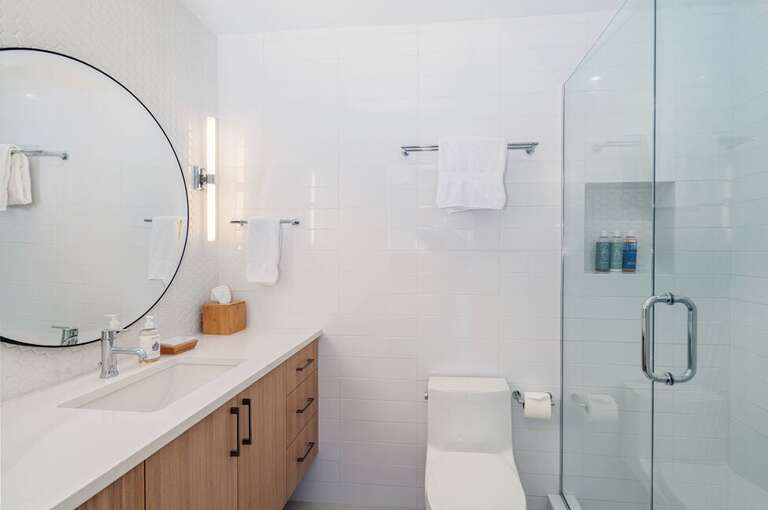 The king master en suite has a spacious vanity and shower.