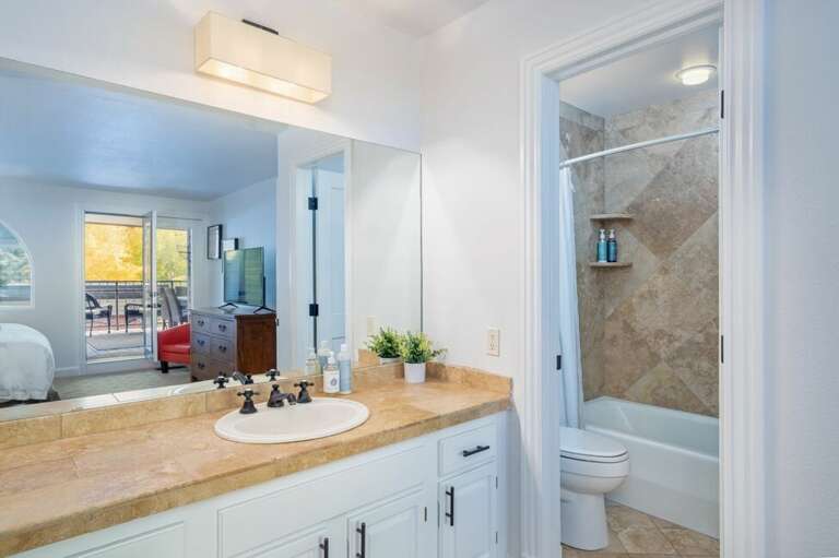 Enjoy the full en suit  Primary Bathroom with large vanity.